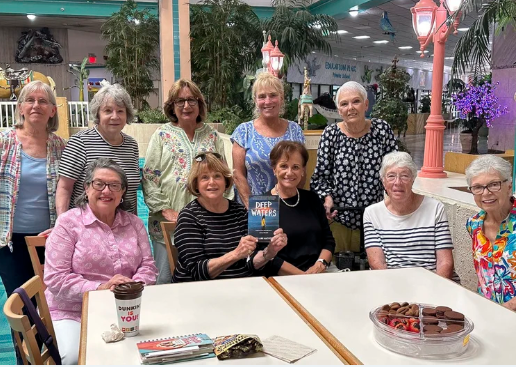 A community reading group gathered around a table